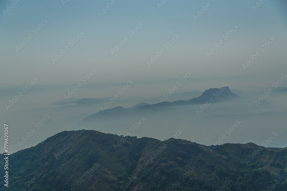 The sky is cloudy and the mountains are covered in fog The sky is cloudy and the mountains are covered in fog