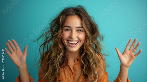 Photo of excited cheerful woman wear shirt smiling open mouth rising arms palms. photo