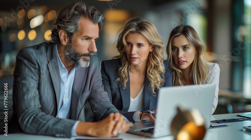 Male CEO and female partner discuss problem solving in office, while looking at laptops. Smart Businesspeople in Finance Work Together. Teamwork Concept.