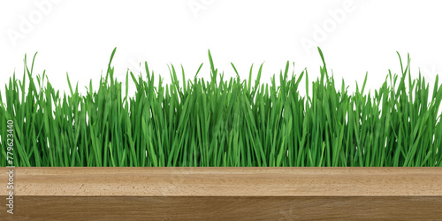 a wooden table on a grass background