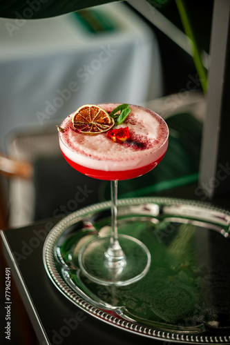 Pink lady alcoholic cocktail drink with gin, grenadine syrup and lemon juice