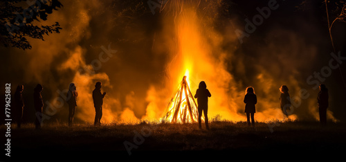 Ritual Dance and Sing Around Walpurgis Night Bonfire. Divination and Magic Rituals of Walpurgis Night, Halloween or Equinox. photo