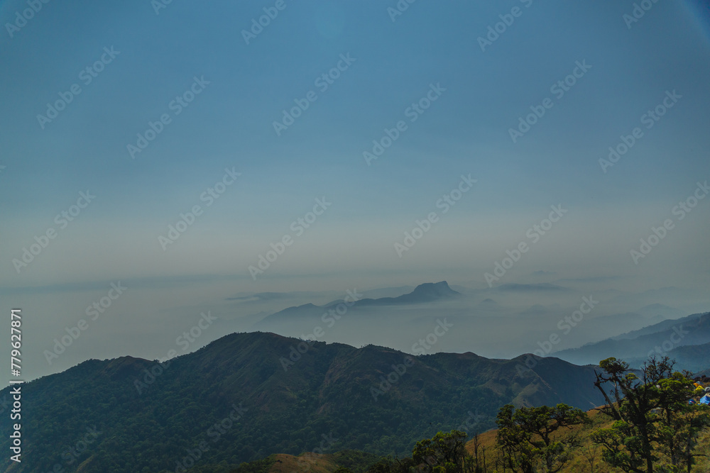 The sky is clear and blue with a few clouds scattered throughout The sky is clear and blue with a few clouds scattered throughout