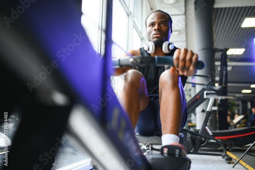 Sports, fitness, healthy lifestyle. African man in the gym.