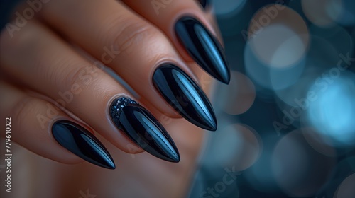 Close-up of female hands with beautiful black manicure on nails.