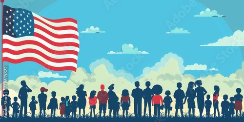 A group of people are standing in a field with a large American flag in the background. The flag is red, white, and blue with stars. The people are of various ages and are standing in a line