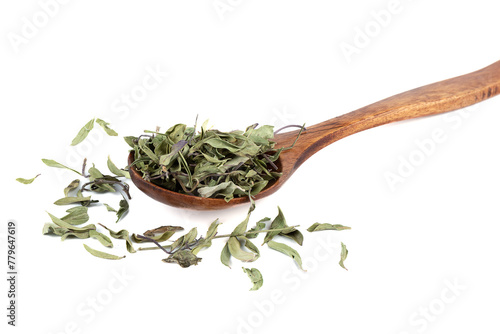 Dried thyme leaves in wooden spoon on white background.