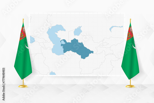 Map of Turkmenistan and flags of Turkmenistan on flag stand.