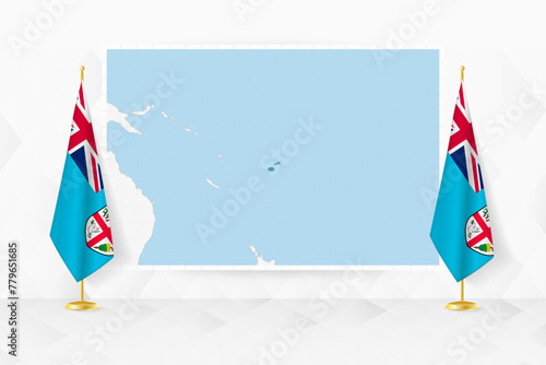 Map of Fiji and flags of Fiji on flag stand.