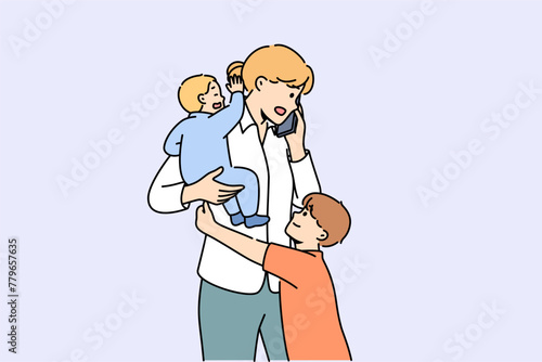 Mother makes business call and babysits children at same time, needing to hire nanny. Multitasking freelance mother is stressed by having to make calls after hours and needs to balance work and family