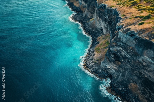Aerial View of the Ocean and Cliffs, A panoramic aerial capture of a blue ocean and a rugged cliff, AI Generated