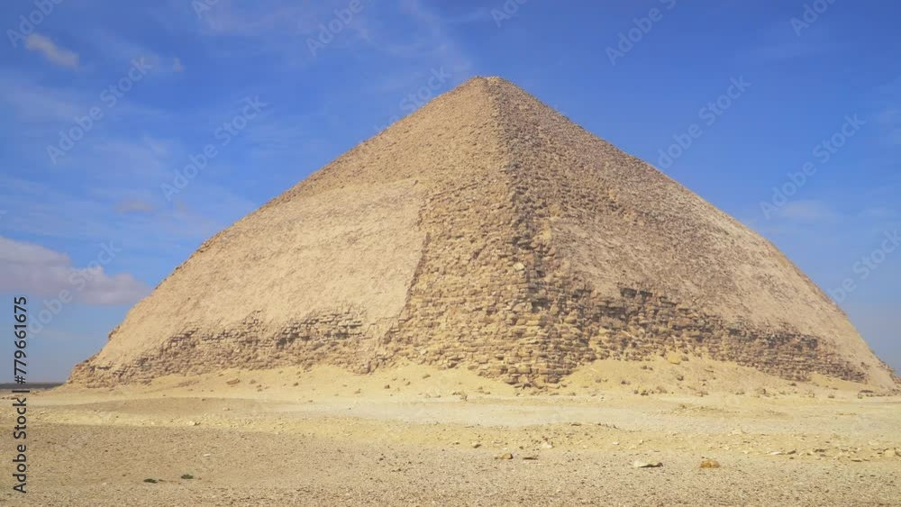 The Bent Pyramid is an ancient Egyptian pyramid located at the royal necropolis of Dahshur, approximately 40 kilometres south of Cairo, built under the Old Kingdom Pharaoh Sneferu. Egypt The Bent Pyramid is an ancient Egyptian pyramid located at the royal necropolis of Dahshur, approximately 40 kilometres south of Cairo, built under the Old Kingdom Pharaoh Sneferu. Egypt