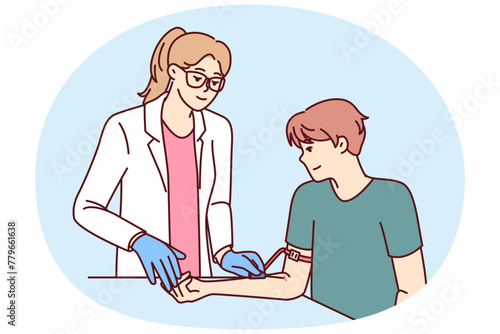 Woman doctor preparing patient for blood test to check for diseases or DNA test. Man patient donates plasma from arm sitting in clinic, wanting to help those in need of blood transfusion
