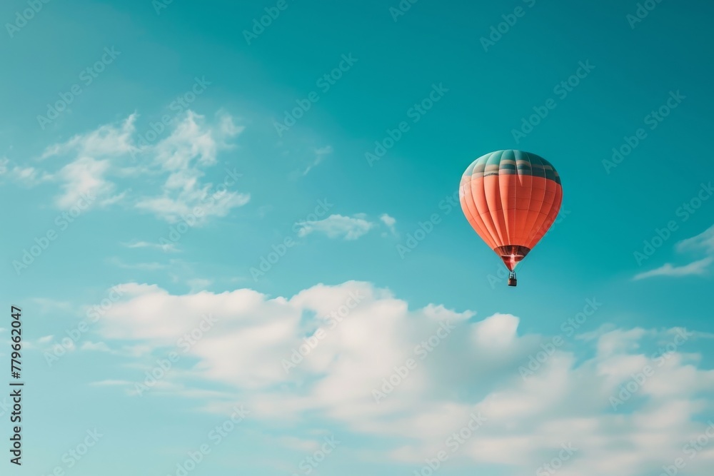 Obraz premium Hot Air Balloon Flying Through a Blue Sky, A plainly colored sky with a single hot air balloon floating, AI Generated