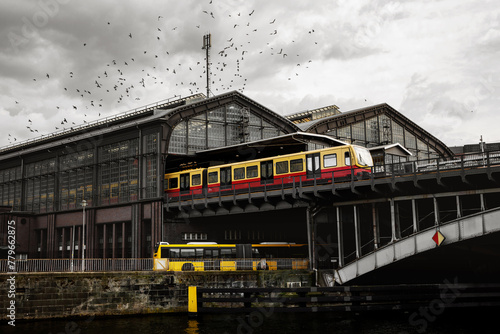 Friedrichstrasse railway station in Berlin. Train on the platform, a flock of birds above the terminal