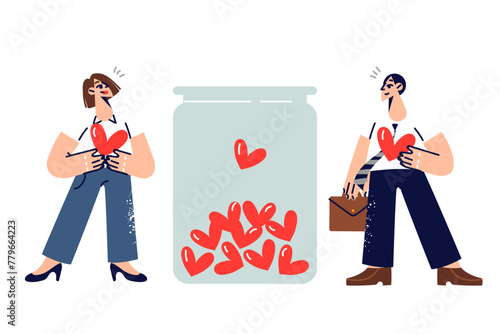 Man and woman act as donors collecting blood for people in need, standing near jar with hearts