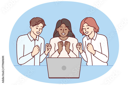 Team of excited friends sitting near laptop and watching football match together. Team of man and two girls watch video broadcast and clench fists, wanting to hear important news via video link