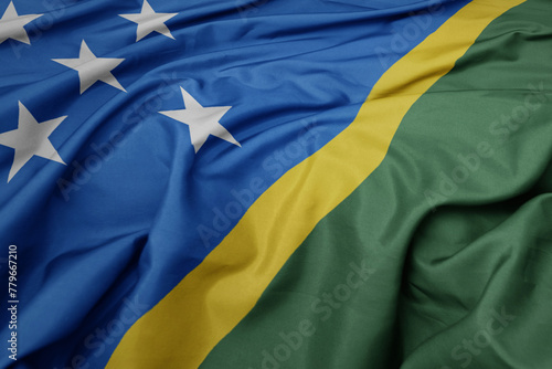 waving colorful national flag of Solomon Islands .