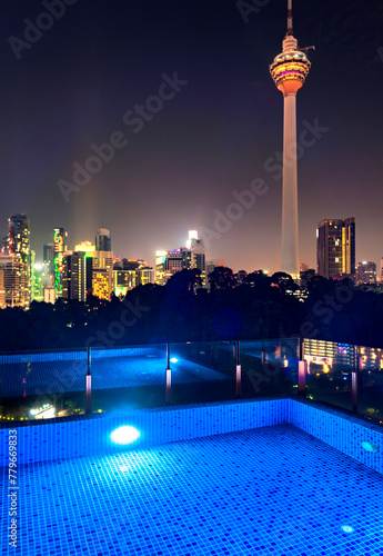 Photography Kuala Lumpur night scene cityscape,and illuminated swimming pool,with KL tower,Malaysia