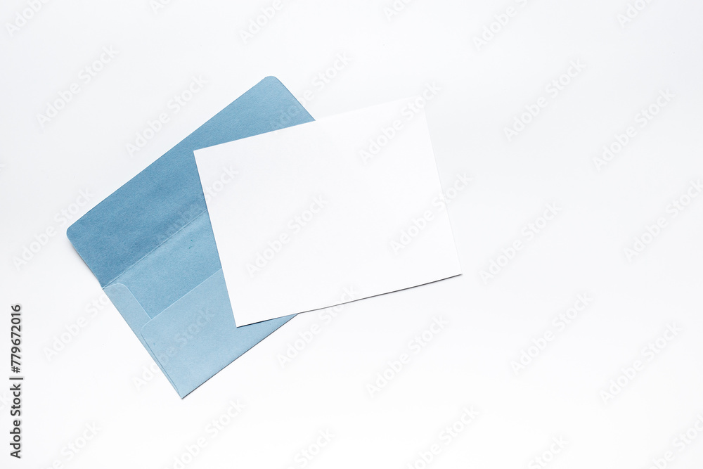 Blank sheet of paper on an envelope for letters. Space for text, top view Blank sheet of paper on an envelope for letters. Space for text, top view