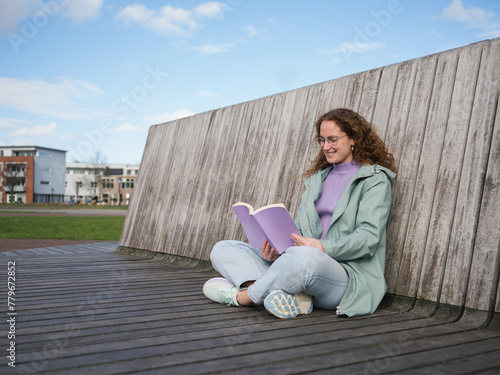 Photography Young Woman Lost in a Good Book in Urban Outdoor Setting