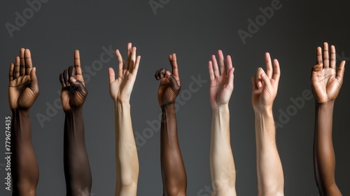Group of diverse arms raised up hand up, hands raised in the air. Concept of Social diversity for global equality and peace with colorful people hands.