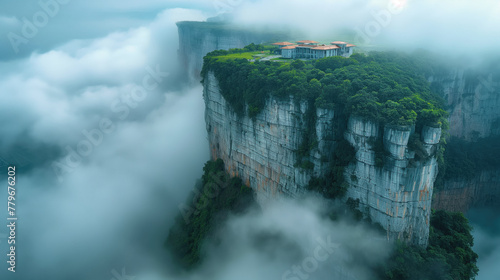 Aerial view of beautiful mountain peaks in fog, panoramic view of canyons.