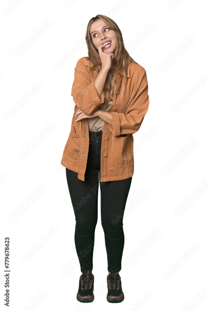 Studio portrait of a blonde Caucasian woman relaxed thinking about something looking at a copy space. Studio portrait of a blonde Caucasian woman relaxed thinking about something looking at a copy space.
