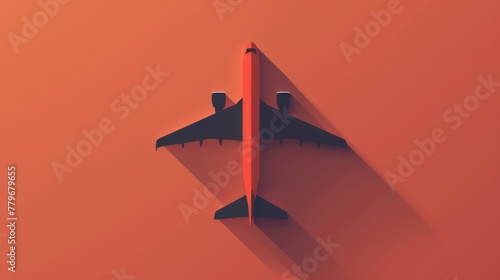 Silhouette of a commercial airplane on a bright orange background that brings to mind thoughts of travel, aviation and solitude