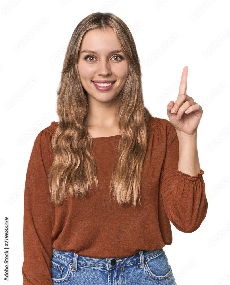 Studio portrait of a blonde Caucasian woman showing number one with finger. Studio portrait of a blonde Caucasian woman showing number one with finger.