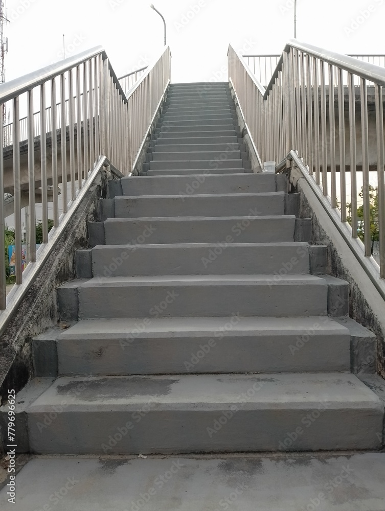 Heavenly Ascent: A stone staircase in the park, leading to success under the blue sky, blending old architecture with modern perspectives Heavenly Ascent: A stone staircase in the park, leading to success under the blue sky, blending old architecture with modern perspectives