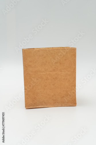 Brown paper bag on white background