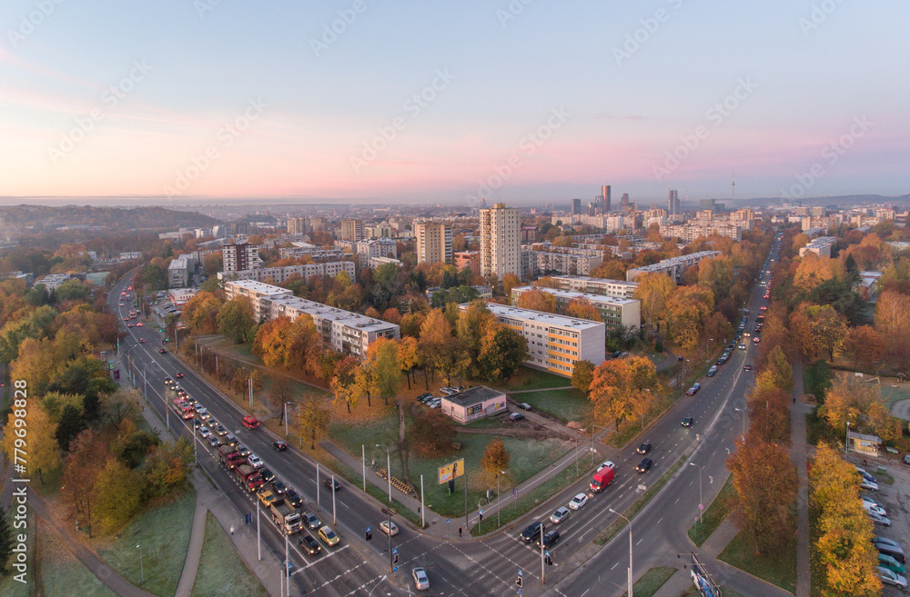Zirmunai District in Vilnius City, Lithuania. Morning Traffic. Autumn Leaves Color. Morning Golden Hour Light.
