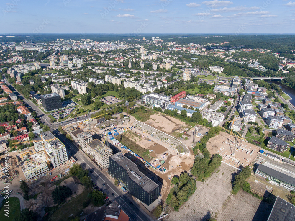 Vilnius City Cityscape, Lithuania. Snipiskes Zirmunai District, Business Town in Background. Drone Point of View. Abandoned Zalgiris Stadium