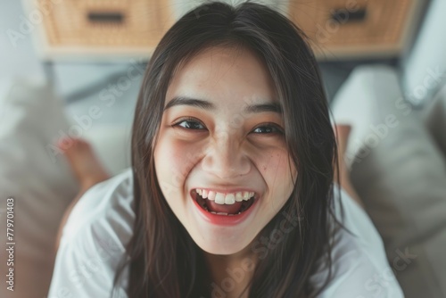 Joyful young woman looking up with a captivating smile. generative ai