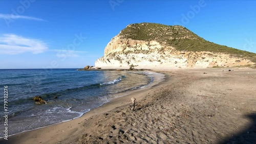 Beautiful sunrise view of Cala Enmedio beach in Cabo de Gata, next to Agua Amarga, Nijar, Almeria, Andalusia, Spain photo