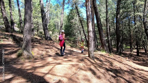 Wallpaper Mural Girl and woman hiking on a path in a forest in La Pedriza, Manzanares el Real, Madrid, Spain Torontodigital.ca