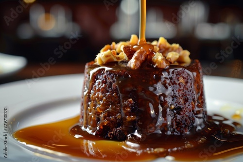 Toffee pudding with caramel and nuts photo
