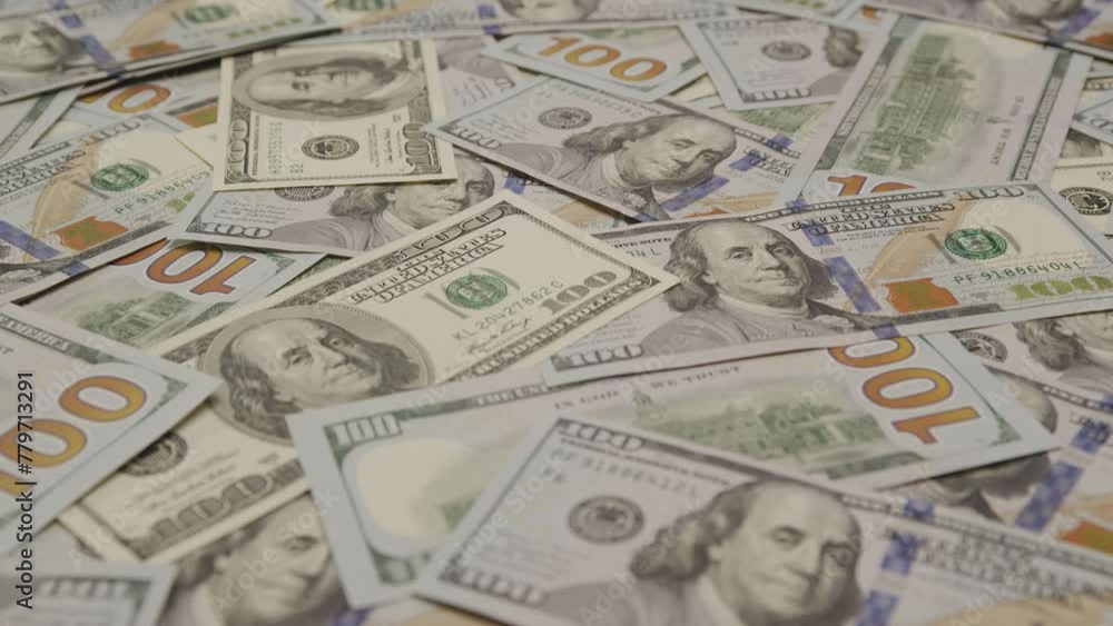 Scattered Hundred Dollar Bills on Desk Scattered Hundred Dollar Bills on Desk