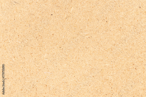 Natural recycled chipboard background texture. Full frame