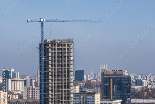 tower cranes on construction site  providing housing for low-income citizens of third world countries