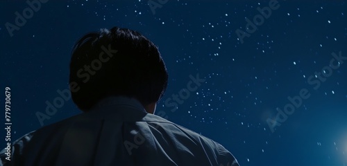 Man silhouette behind view observing sky stars cinematic darkness peace introspection
