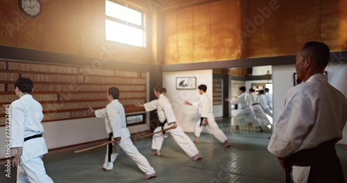 Japanese students, teaching or sensei in dojo to start aikido practice, discipline or self defense education. Black belt master, people learning combat or ready for fighting class, training or lesson