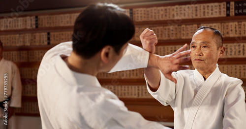Aikido class, student and sensei for martial arts, learning and advice for combat at training, gym and dojo. Japanese people, block and sports with fight, workout or fitness for zen, conflict or club