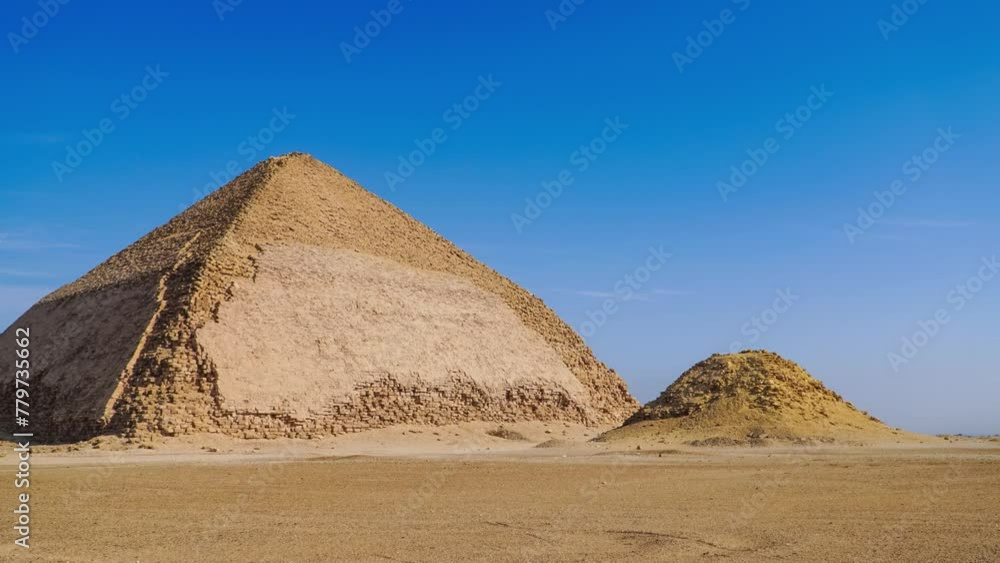 The Bent Pyramid is an ancient Egyptian pyramid located at the royal necropolis of Dahshur, approximately 40 kilometres south of Cairo, built under the Old Kingdom Pharaoh Sneferu. Egypt The Bent Pyramid is an ancient Egyptian pyramid located at the royal necropolis of Dahshur, approximately 40 kilometres south of Cairo, built under the Old Kingdom Pharaoh Sneferu. Egypt