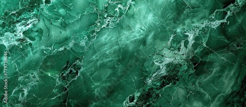 A detailed view of a lush green marble texture, resembling a mix of water, terrestrial plants, grass, jungle patterns, rocks, soil, and natural landscapes with hints of darkness and natural materials