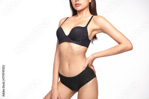 Confident beautiful young asian woman posing in black lingerie on white background, Perfect body,