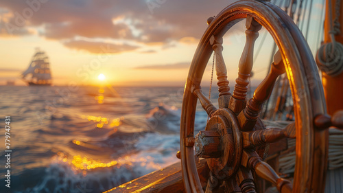 Ship wheel with sunset and sailboat.