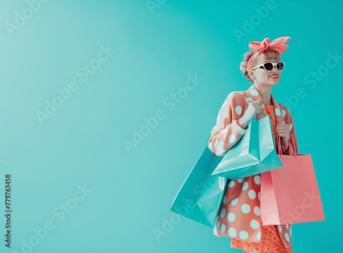 A beautiful young Asian woman is carrying colorful shopping bags and smiling happily, with a blue sky background behind her