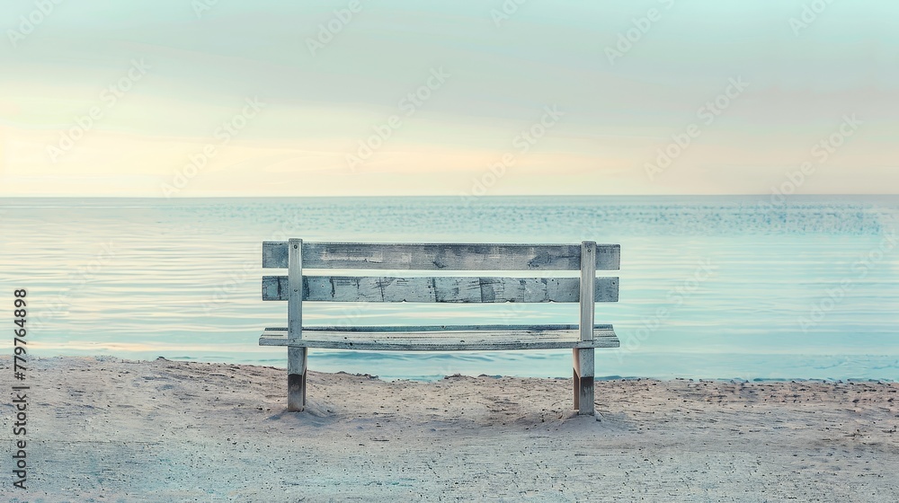 Vintage wooden bench by the sea, on an empty beach, under the serene sea light of early morning, perfect for tranquil product displays